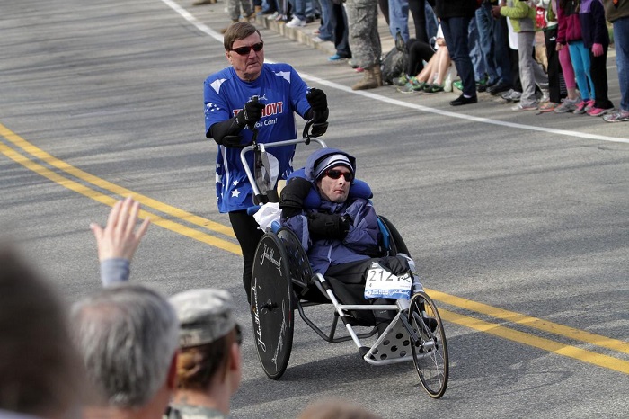 (041513 Hopkinton, MA) Dick Hoyt and his son Rick Hoyt run during the 117th Boston Marathon in Hopkinton, Mass., Monday, April 15, 2013. Photo by Chitose Suzuki