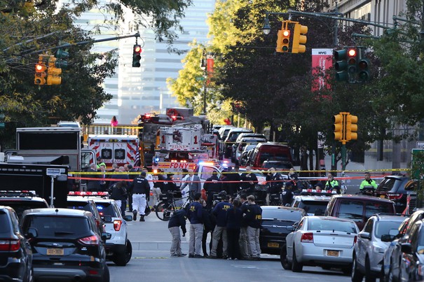 NEW YORK, USA - OCTOBER 31 : Security forces cordon off the area after a man reportedly drove a pick up truck along a bike lane near the West Side Highway in New York City on October 31, 2017. Eight people were reportedly killed in the incident, at least 12 were injured. Mohammed Elshamy / Anadolu Agency