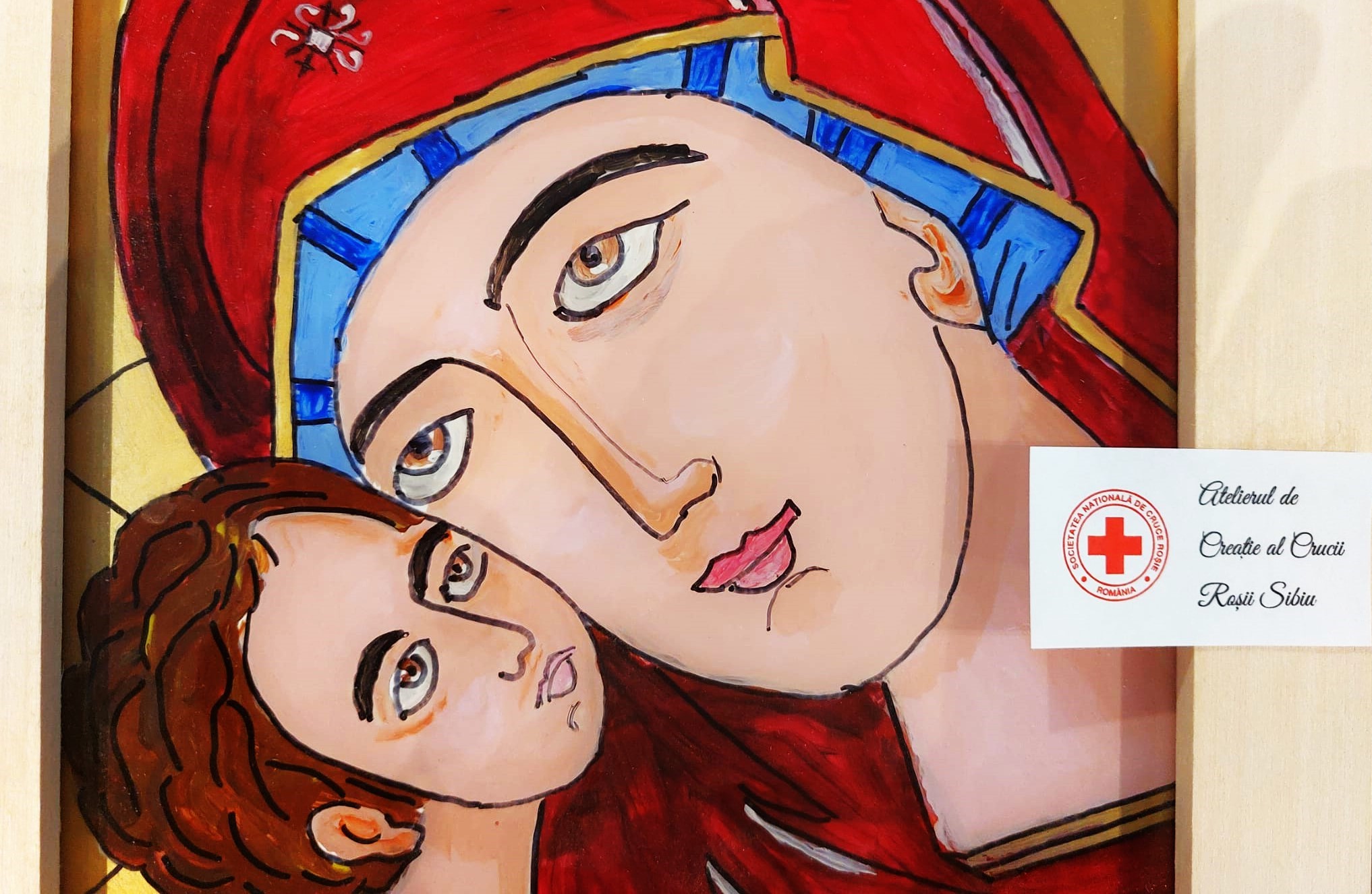 Expoziție de icoane pe sticlă la Șura Culturală din Gușterița. Picturile sunt realizate de voluntarii seniori ai Crucii Roșii