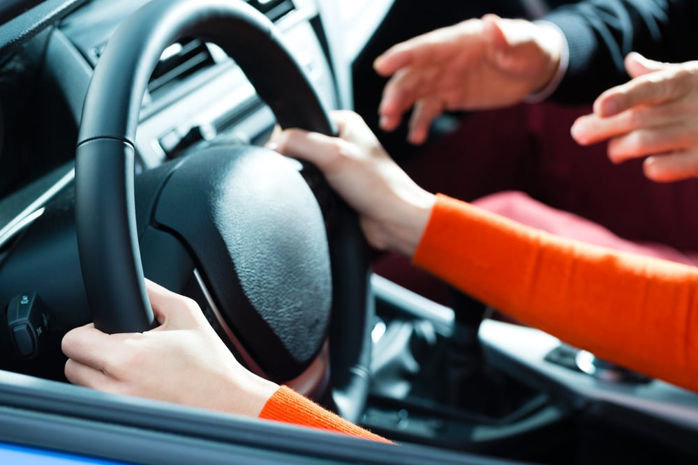 Young woman at driving lesson