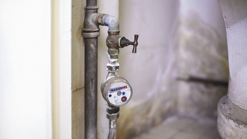 Water-meter for controlling hot water consumption in house, utilities closeup