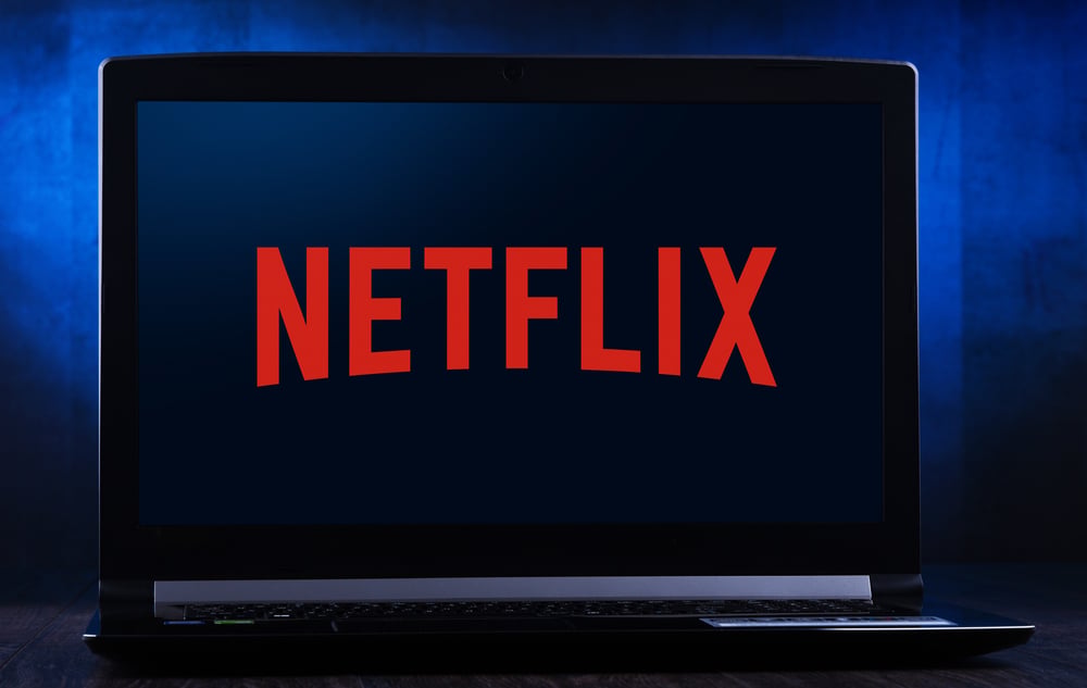 Laptop computer displaying logo of Netflix