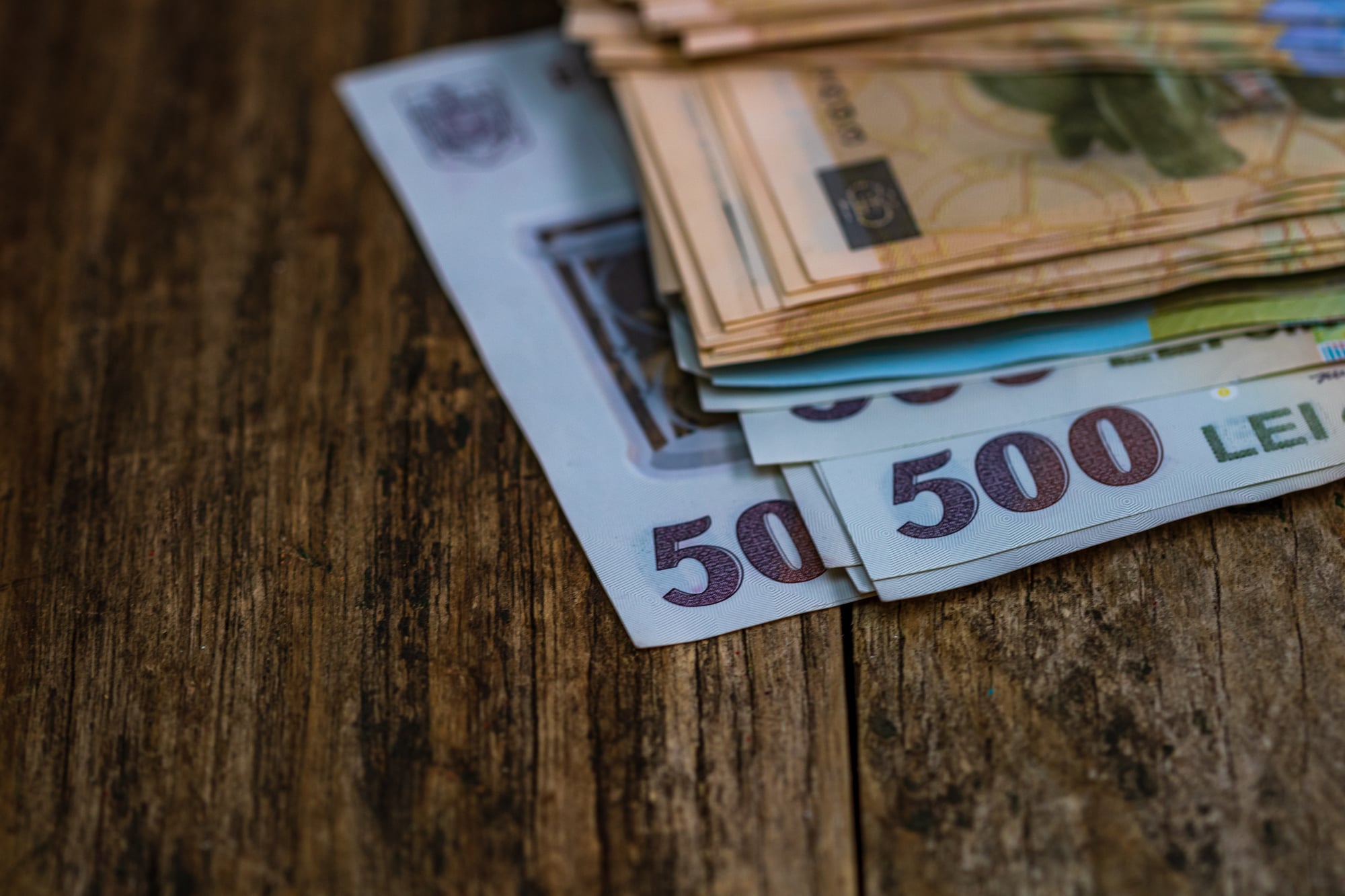Selective focus on stack of LEI romanian money. Lei banknotes isolated.