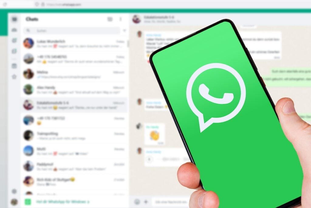 WhatsApp logo messenger app on a mobile phone and computer