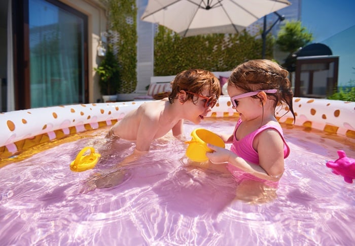 Excited,Kids,Having,Fun,In,Inflatable,Swimming,Pool,At,Home